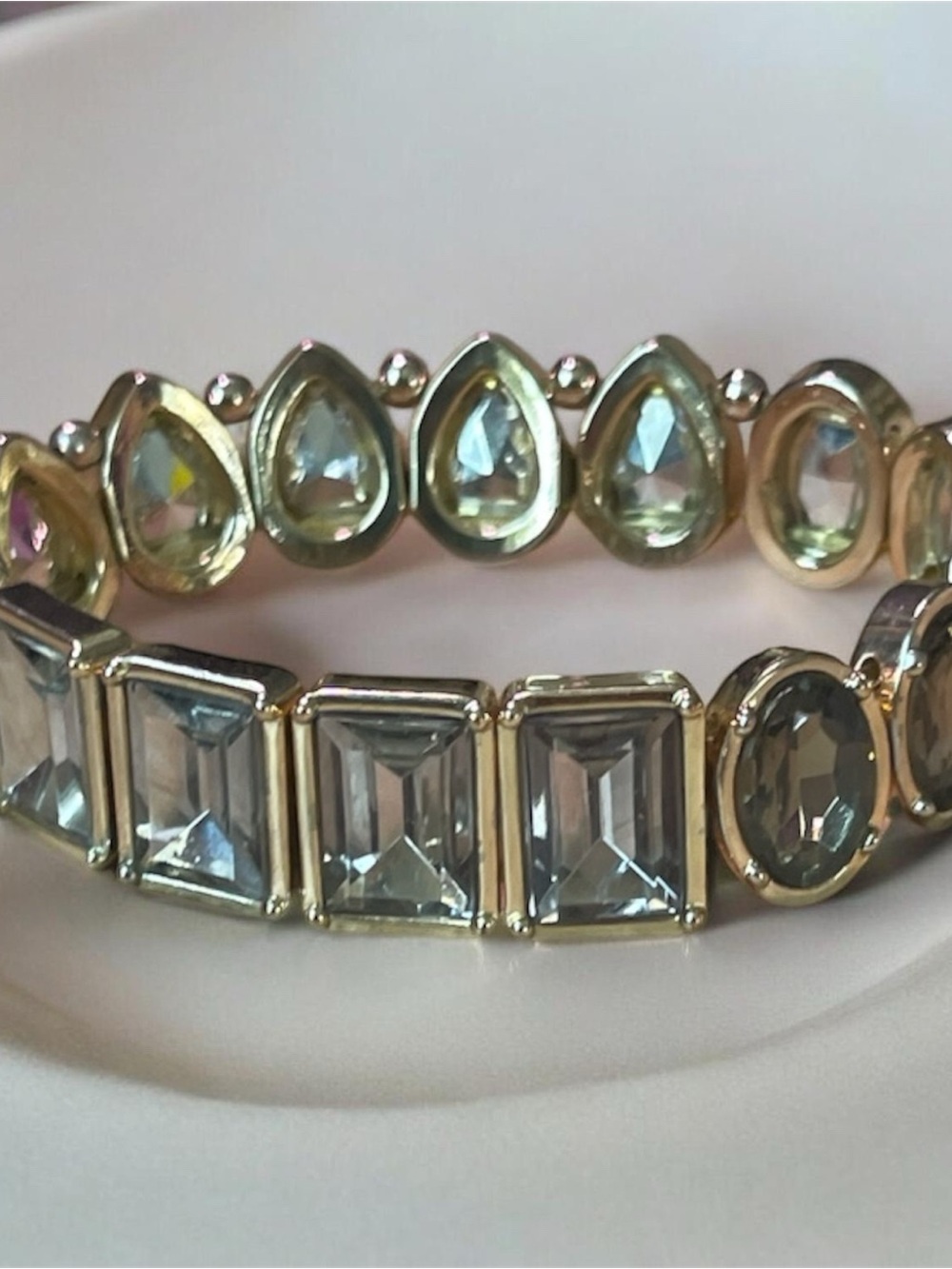 gold-tone stretch statement bracelet features multi-shaped faceted smoke